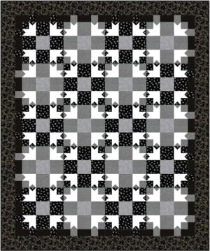 The Dark Shadows Quilt features a black, white, and gray color scheme with a repeating geometric pattern of squares and star-like shapes, framed by a black floral border. Its checkerboard effect creates a striking and elegant design.