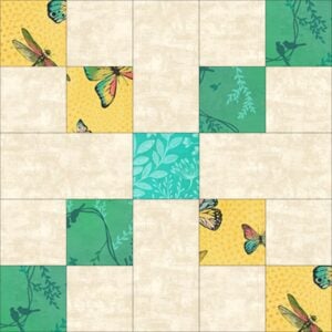 Songbird-Block A quilt block pattern made of square patches in beige, yellow with butterflies, teal with leaves, and green with dragonflies, arranged in a symmetrical design.