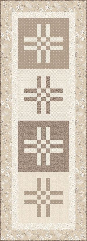 Crossroads Table Runner quilt pattern with four crossroads blocks in cream and brown on alternating light and dark squares, framed by a beige floral border